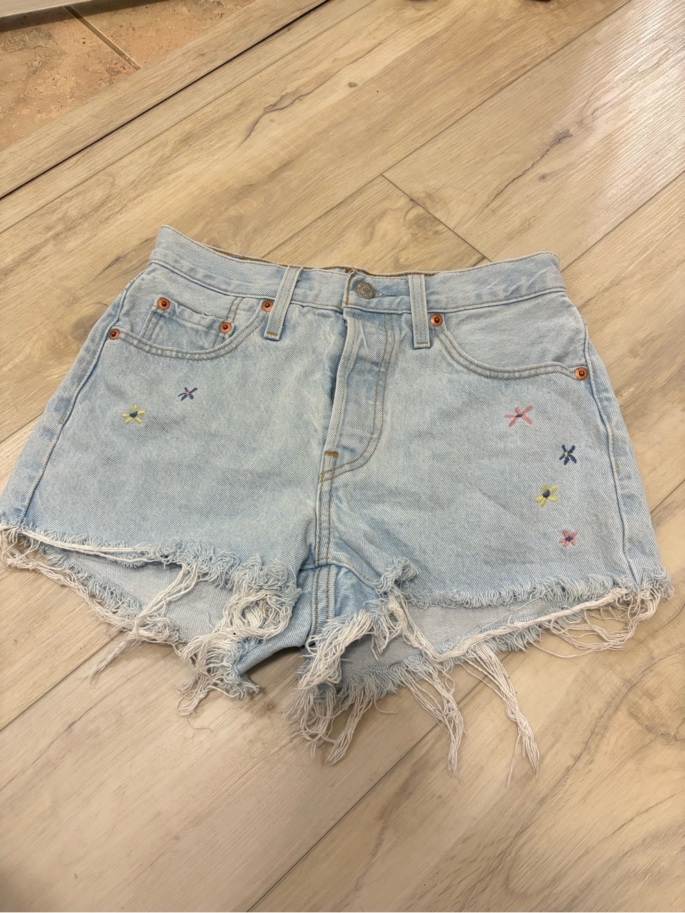 Levi’s Light Wash Floral Embroidery cut off shorts